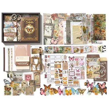 A butterfly-themed scrapbooking kit displayed as a flat lay, featuring a black box with a decorative book, sheets of patterned paper, washi tapes, stickers, embellishments, and colorful butterfly cutouts on a white background.